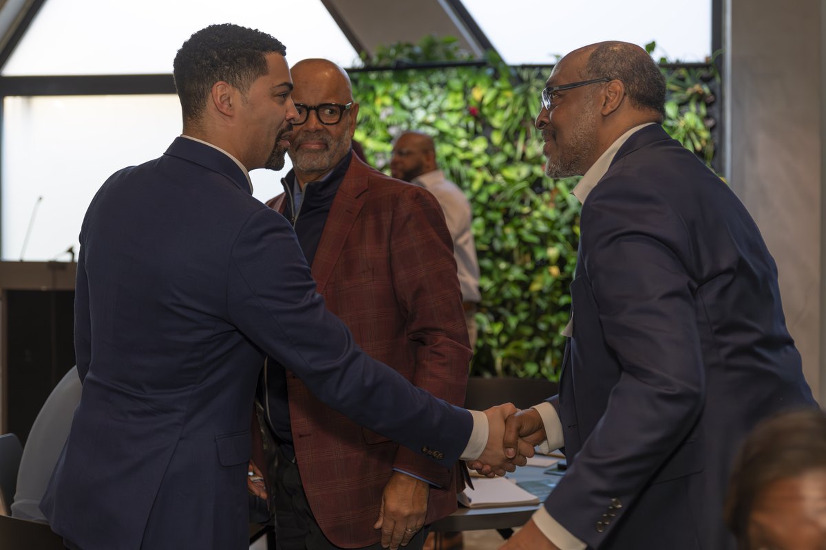 An institutional buyer shaking hands with a local contractor