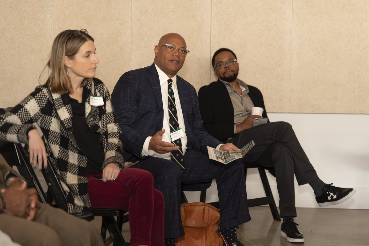Panelists in conversation on stage at an Inclusive Growth Summit session