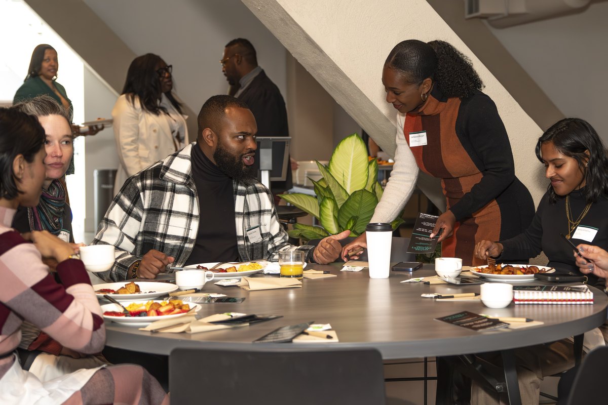 Residents gathered around a roundtable discussing neighborhood priorities